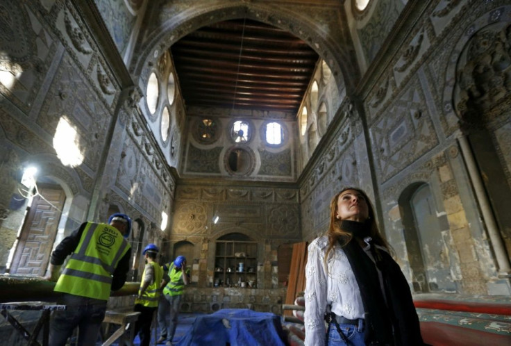 Rania Kataf and restoration workers are seen at the palatial Ottoman-era Beit al-Quwatli