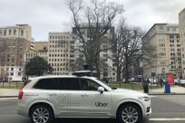 An Uber car equipped with cameras and sensors drives the streets of Washington, DC, on January 24, 2020. Uber agreed to sell its Advanced Technologies Group to Aurora in exchange for a stake in the tech startup