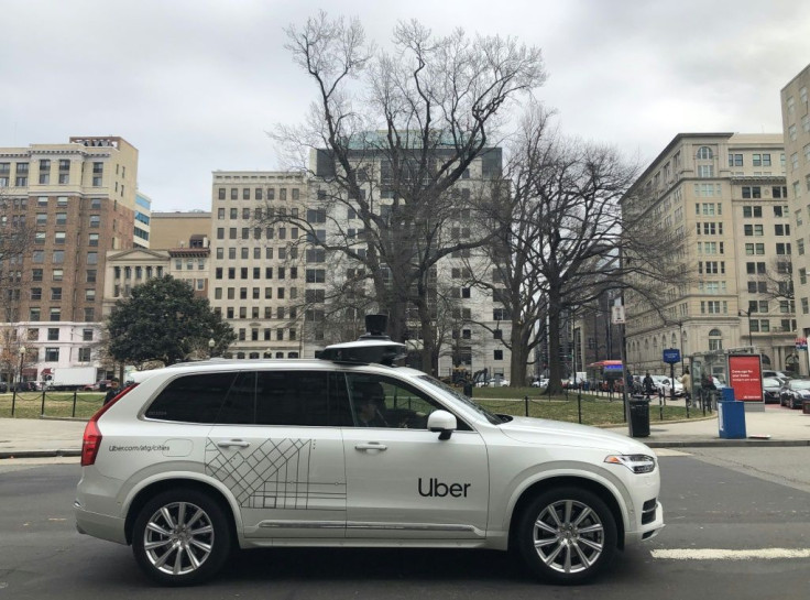 An Uber car equipped with cameras and sensors drives the streets of Washington, DC, on January 24, 2020. Uber agreed to sell its Advanced Technologies Group to Aurora in exchange for a stake in the tech startup