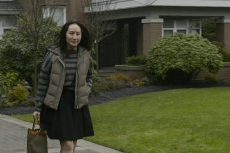 IMAGES Huawei executive Meng Wanzhou leaves her home, walks down the driveway and gets into her car as she heads to court for her extradition hearing. Meng, the chief financial officer of the Chinese tech giant, has been fighting extradition from Canada t