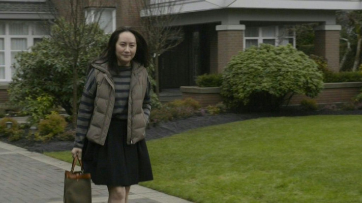 IMAGES Huawei executive Meng Wanzhou leaves her home, walks down the driveway and gets into her car as she heads to court for her extradition hearing. Meng, the chief financial officer of the Chinese tech giant, has been fighting extradition from Canada t