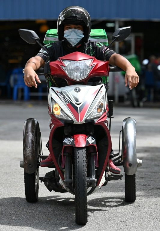 Sidek rides a modified four-wheeled motorbike, zipping from restaurants to people's homes delivering food