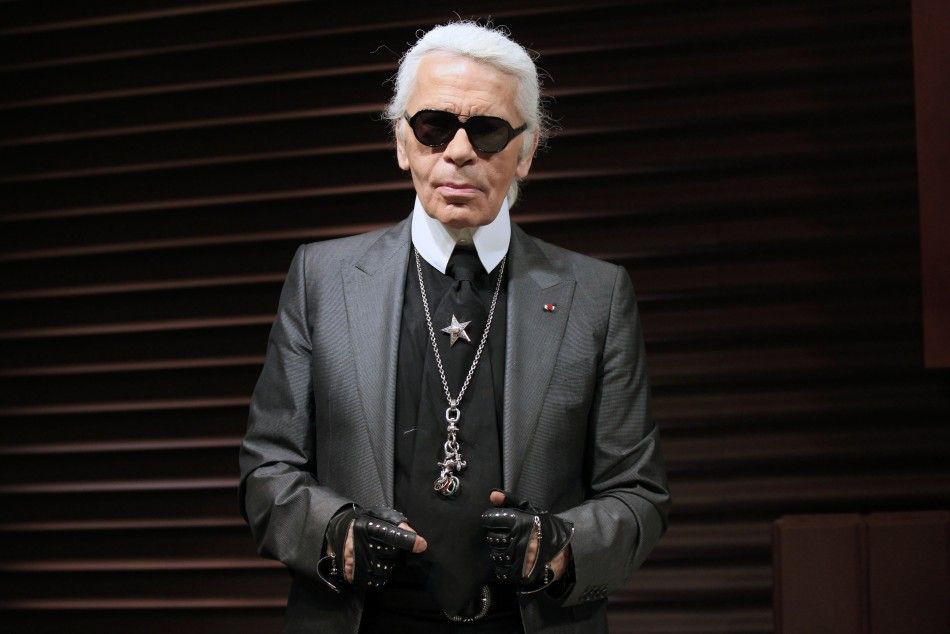German designer Karl Lagerfeld poses as he unveils his hotel suite creation made of chocolate, part of a campaign by a leading ice cream brand, at a hotel in Paris April 28, 2011.