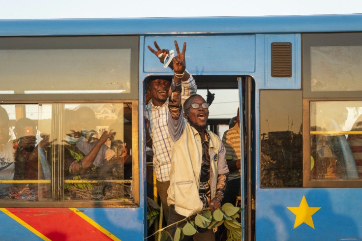 Tshisekedi supporters gesture from a Kinshasa bus on Sunday, when the president made his speech about the country's future