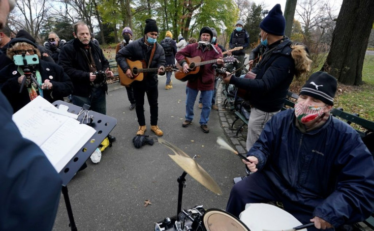 People play music in Central Park on the 40th anniversary of John Lennon's death on December 8, 2020