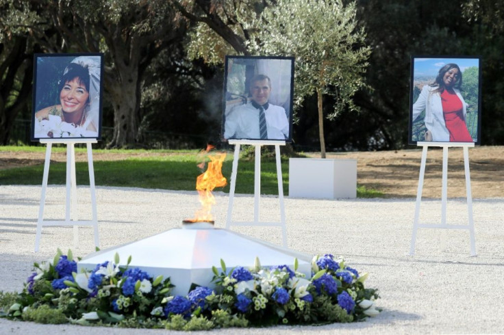 Portraits of the three victims of an attack at Notre-Dame de Nice Basilica -- one of a series of assaults in France by Islamic extremists -- at a November 2020 ceremony