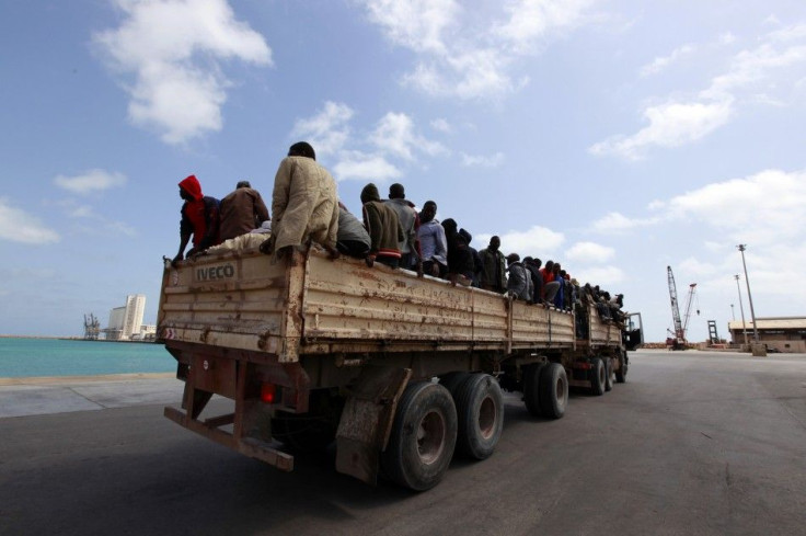 Migrant workers from Niger are transported into Misrata port to be evacuated to Benghazi