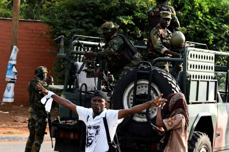 An opposition supporter walks past a truck in Accra -- Ghana has long been known for its peaceful transferral of power