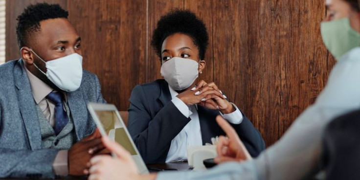 Business People Wearing Face Masks and Talking