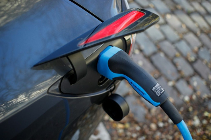 A Tesla electric car being charged in Berlin. Electric vehicles are expected to finally make a breakthrough to the mass market