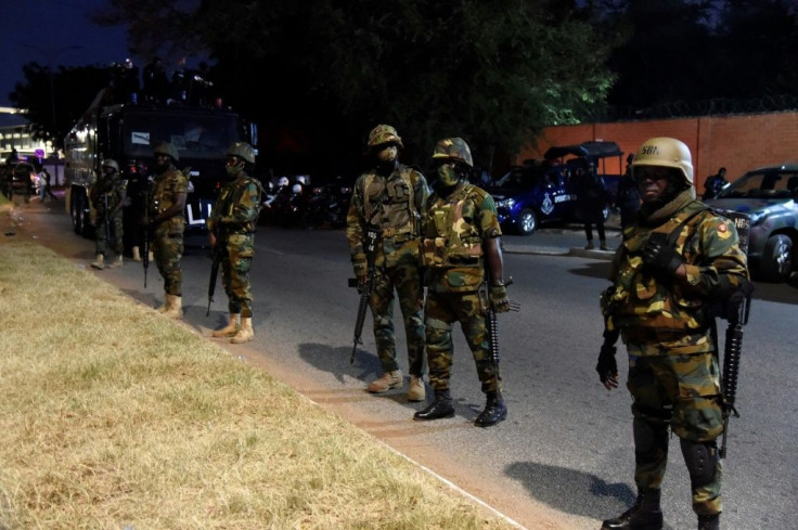 Soldiers guard the electoral commission, which announced Akufo-Addo's re-election