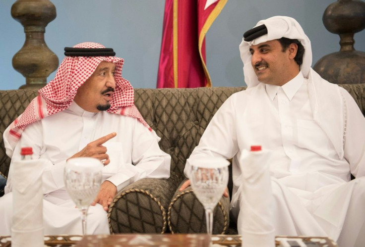 Saudi King Salman (L) chats with Emir of Qatar Sheikh Tamim bin Hamad al-Thani in Doha in December 2016, seven months before the rift between Doha and a Riyadh-led quartet of countries