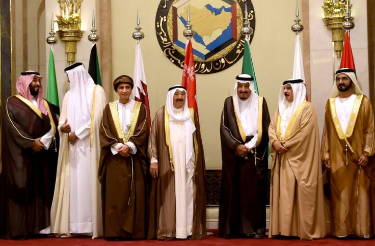 Saudi Crown Prince Mohammed bin Salman (left), Qatar's Emir Sheikh Tamim bin Hamad al-Thani (second left) shake hands during a 2016 Gulf Cooperation Council meeting in Jeddah