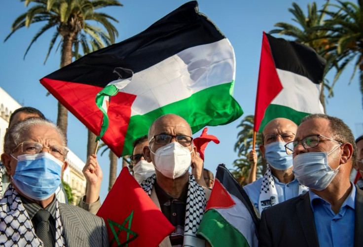 Moroccans wave the Palestinian flag during a demonstration in the capital Rabat in September 2020 to denounce Arabs' normalization with the Jewish state -- a step now taken by Morocco