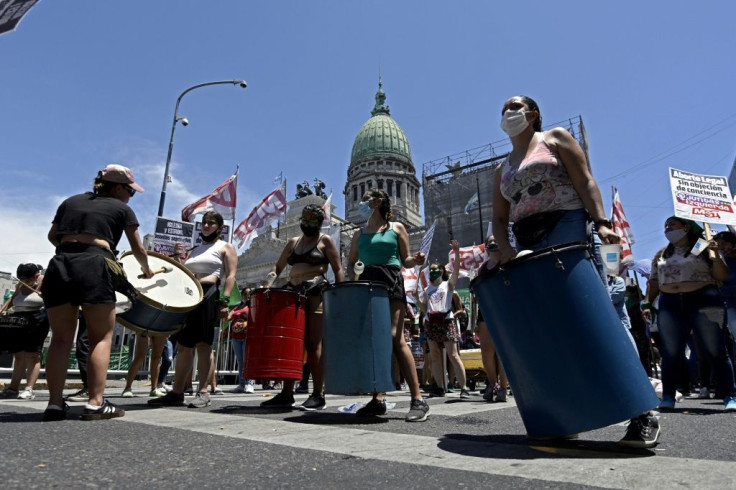 Pro-abortion activists demonstrate with drums outside the Argentine Congress in Buenos Aires, on December 10, 2020, where legislators began debating a bill to legalize abortion