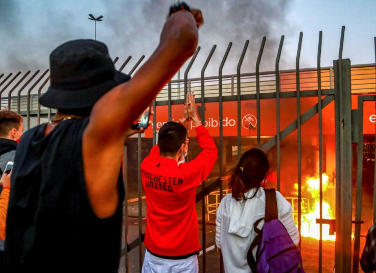 Protesters demonstrate in front of a Carrefour supermarket in Porto Alegre on November 20, 2020