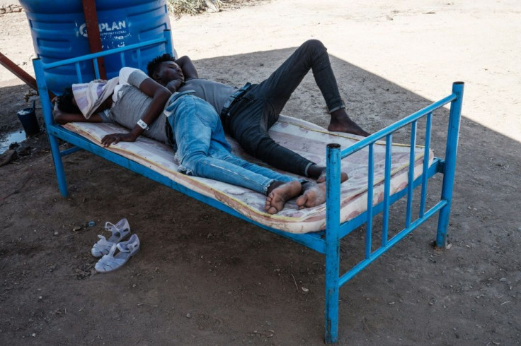 Eritrean refugees who fled Ethiopia's Tigray conflict, rest on a bed at the border reception centre in Hamdayit, eastern Sudan