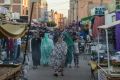 People walk in a market street in Western Sahara's main city of Laayoune in November 2018