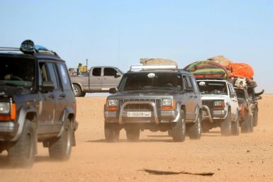 Libyans take part in a 4x4 tourism trip through the desert