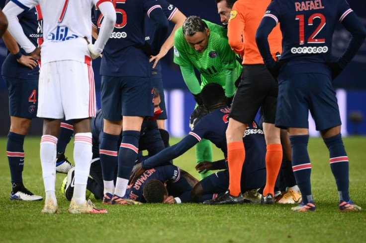 Team-mates attempted to comfort Neymar after he suffered a serious-looking ankle injury in stoppage time of PSG's loss to Lyon