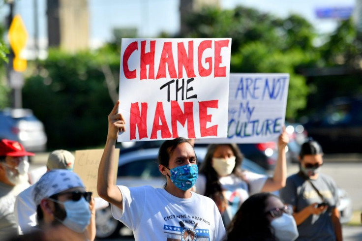 A group of protesters demonstrate against the Cleveland Indians mascot prior to the Opening Day game between the Cleveland Indians and the Kansas City Royals at Progressive Field on July 24, 2020 in Cleveland, Ohio