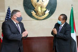 US Secretary of State Mike Pompeo (L) greets Prime Minister Abdalla Hamdok (R) in Khartoum during a visit to Sudan's capital in August