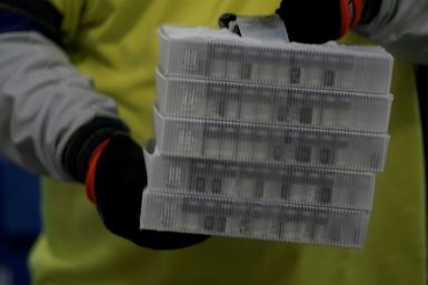 Vials in boxes containing the Pfizer-BioNTech Covid-19 vaccine are prepared to be shipped at the Pfizer Global Supply Kalamazoo manufacturing plant in Kalamazoo, Michigan