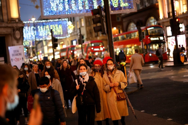 Shoppers on Oxford Street in London as it was announced that the city will move to the highest level of anti-virus restrictions