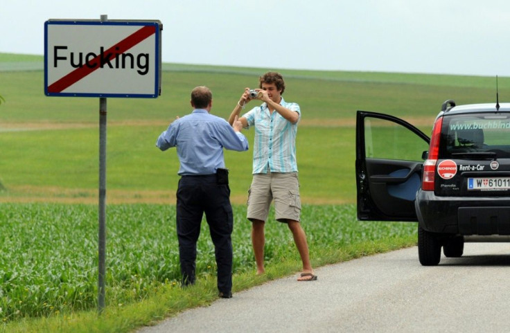 Fugging hell: Tourists take a picture in front of a sign of the village of Fucking in Austria