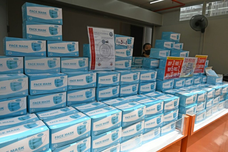 Boxes of face masks on sale in Singapore, which will allow business travellers and visiting officials from all countries to enter from next year