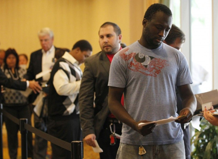 People wait in line to attend a job fair for military veterans and other unemployed people in Los Angeles