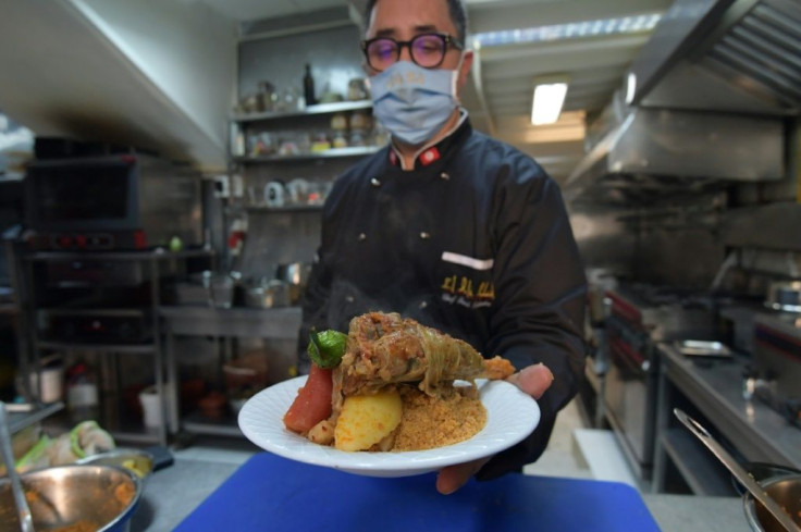 Tunisian chef Taieb Bouhadra presents a traditional Tunisian lamb couscous dish at a restaurant in the capital Tunis