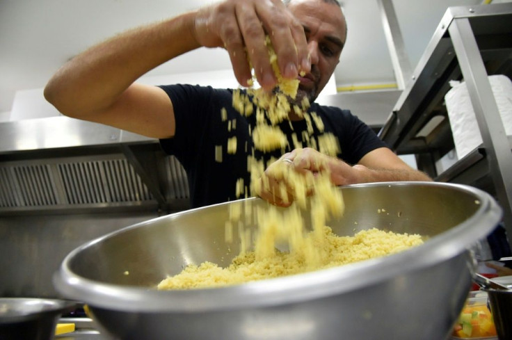 Algerian chef Rabah Ourrad prepares a dish of couscous at a kitchen in the capital Algiers