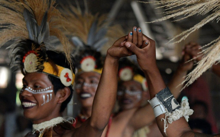 Gay indigenous men perform in Colombia's community of Nazareth, which has become a place where LGBT members can build a life