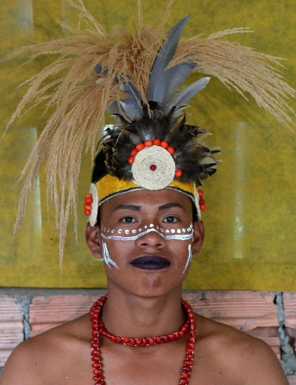 A gay indigenous man poses for a picture in the community of Nazareth