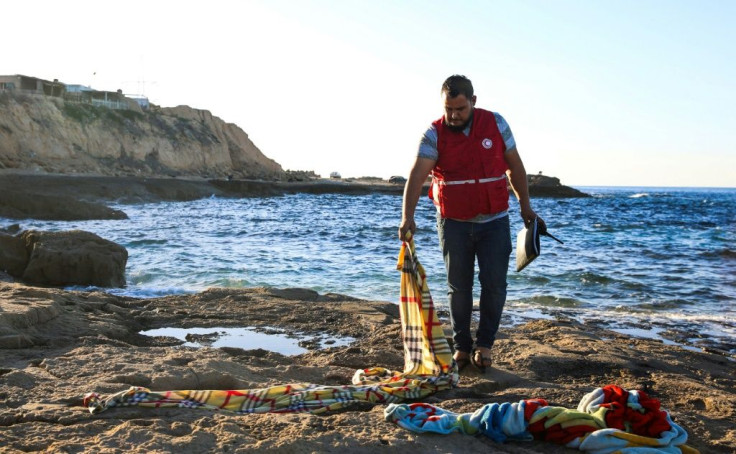 Blankets, including those for a baby, lay on the rocks near where the bodies were found, an AFP correspondent said