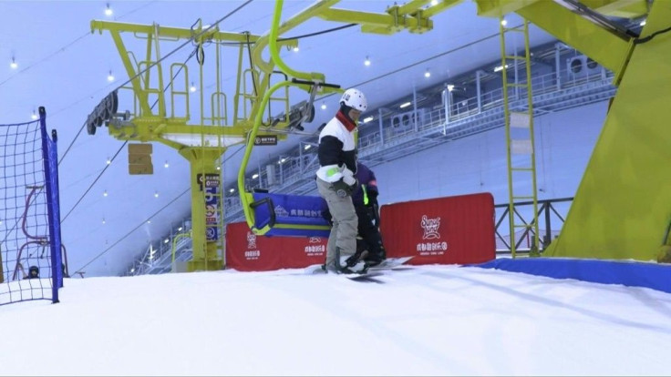 Speeding down a steep slope, snowboarder Zhang Xu skids gracefully to a halt in a shower of snow -- one of a new generation of winter sports fans in China learning in brand new skiing facilities.