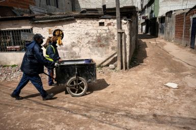 People distribute gas tanks in September to those hit hard by the economic crisis in Buenos Aires, as Latin America and the Caribbean see unemployment rise by over 10 percent