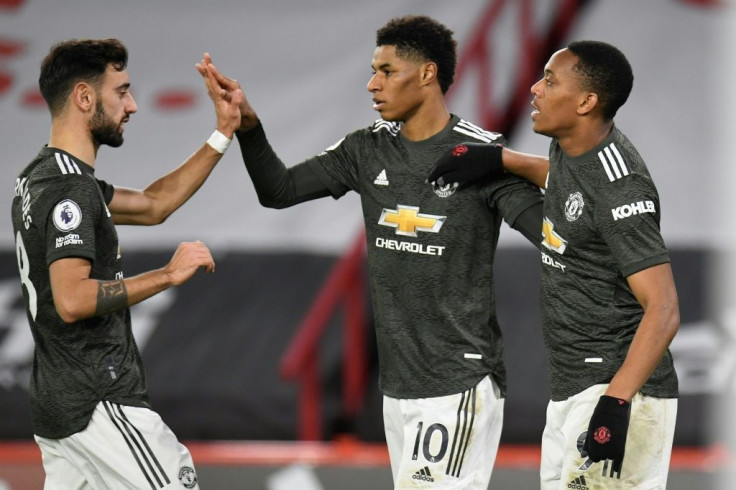 Manchester United forward Marcus Rashford (centre) celebrates his second goal at Sheffield United