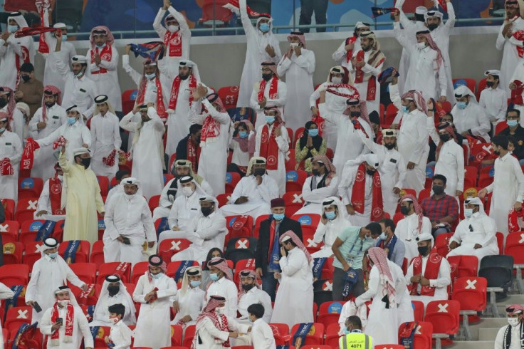 Mostly socially distanced fans watch a domestic cup final at the inauguration of Qatar's new Ahmad Bin Ali stadium, which will host World Cup 2022 matches