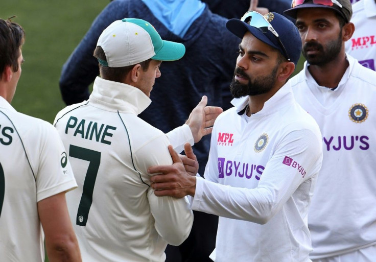 India's captain Virat Kohli congratulates Australia's captain Tim Paine on the third day of the first cricket Test match
