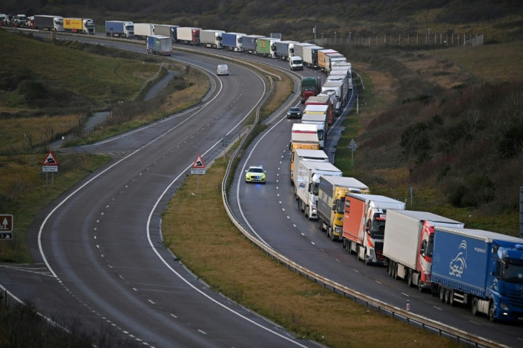 The urgency of reaching a deal is being driven home by scenes of long lines of trucks at the freight rail link through the Channel tunnel as British companies frantically stockpile