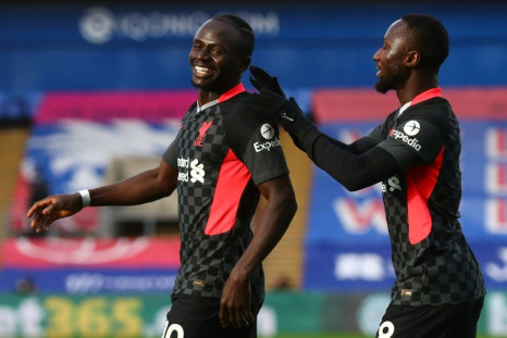 Liverpool forward Sadio Mane (left) celebrates scoring against Crystal Palace