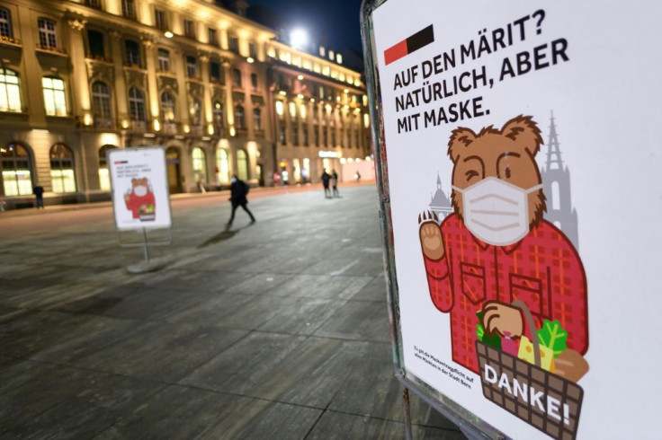 A poster in Bern reads: "In the market? Of course but with a mask"