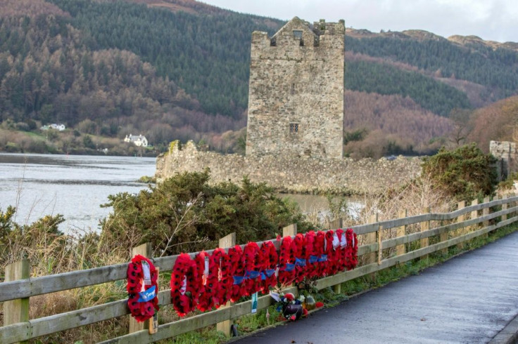 Outside the town, the spot of a 1979 attack on British troops remains marked by a rank of poppy wreaths