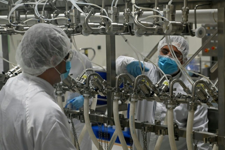 Biochemists work inside a buffer preparation room at Takeda Pharmaceuticals (Asia Pacific) in Singapore. The city-state's  coronavirus-hit economy has received a shot in the arm from robust global drug demand