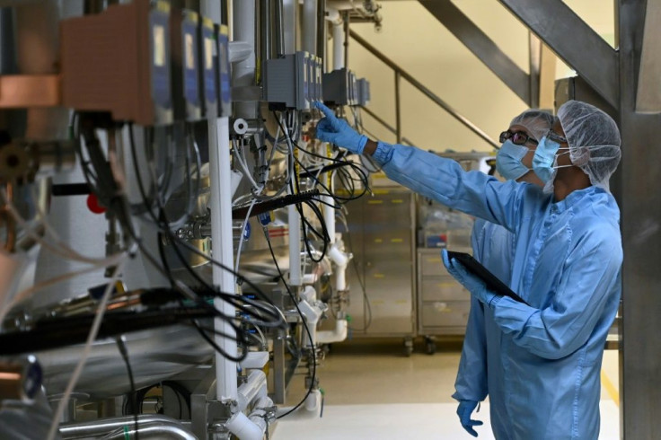 Biochemists check a bio-reactor used for manufacturing medical products at Takeda Pharmaceuticals (Asia Pacific) in Singapore. Among its products, Takeda's facility grows cells from hamster ovaries to make ingredients for drugs to treat haemophilia