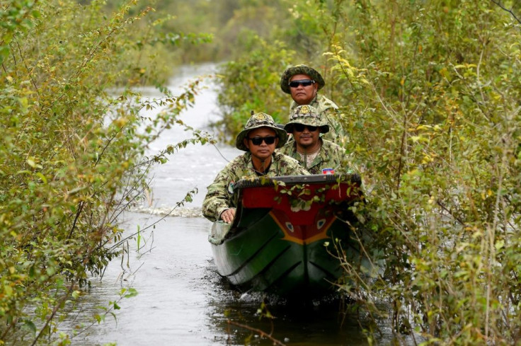 Rangers patrol a bird sanctuary and protected area by Prek Toal floating village on the Tonle Sap