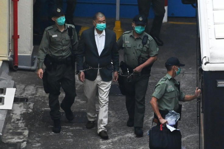 Hong Kong pro-democracy media tycoon and Beijing critic Jimmy Lai (C) is among dozens arrested under the new national security law