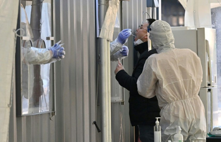 A man is swabbed for coronavirus at a testing facility in Seoul